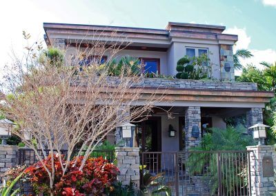Contemporary Stone Facade Home Impact Windows